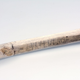 Close-up of a walking stick with a runic inscription, radiocarbon-dated to the 11th century AD. Found in a glaciated mountain pass. Photo: Vegard Vike, Museum of Cultural History.